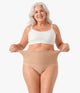 Lace Brief by OnlyShape - Plus size woman stretching high waist floral lace waistband to show stretch fit, beige nude