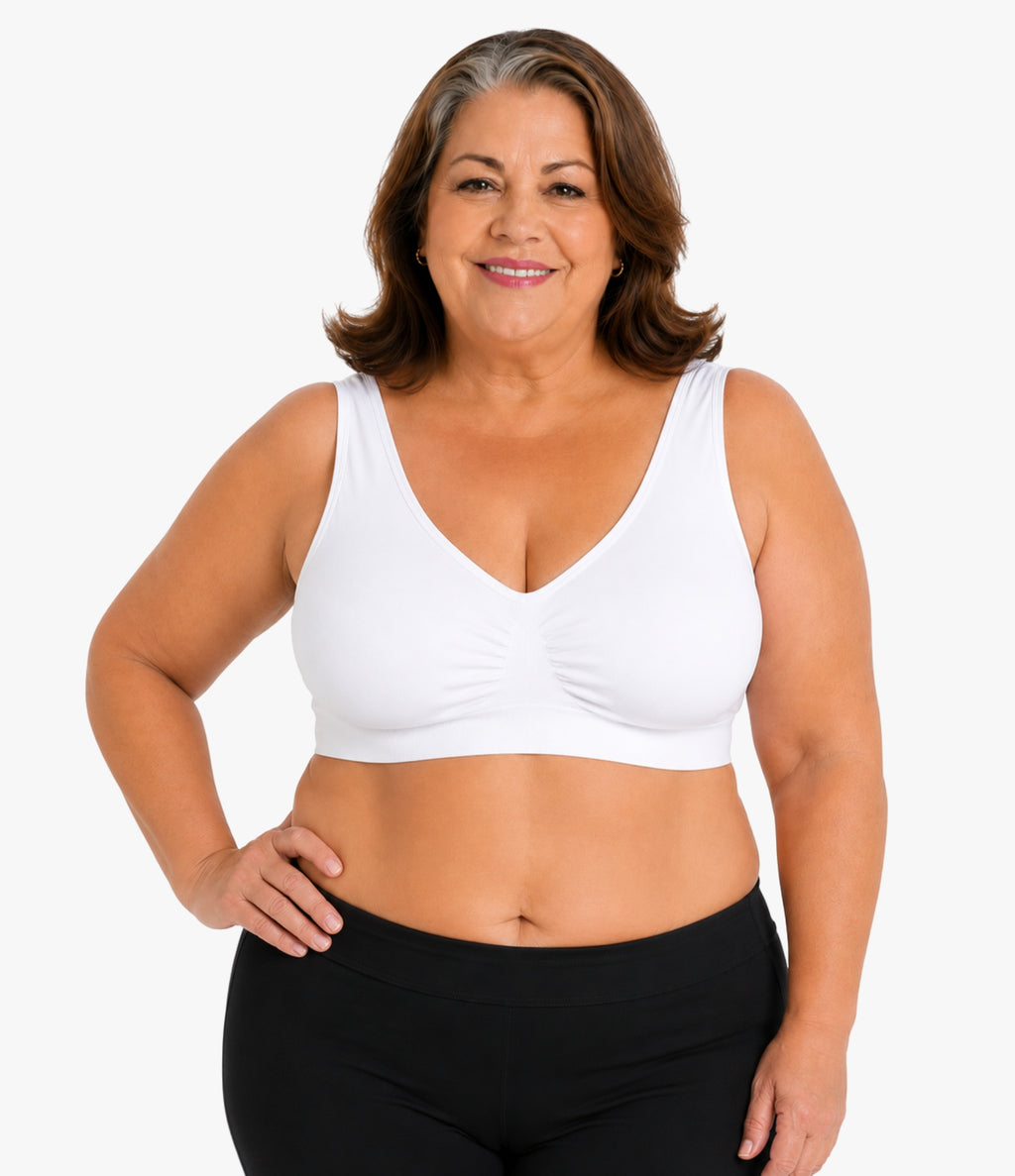 Plus-size woman wearing the OnlyShape Everywear Bra in white — seamless wireless comfort bra, wide straps, V-neckline