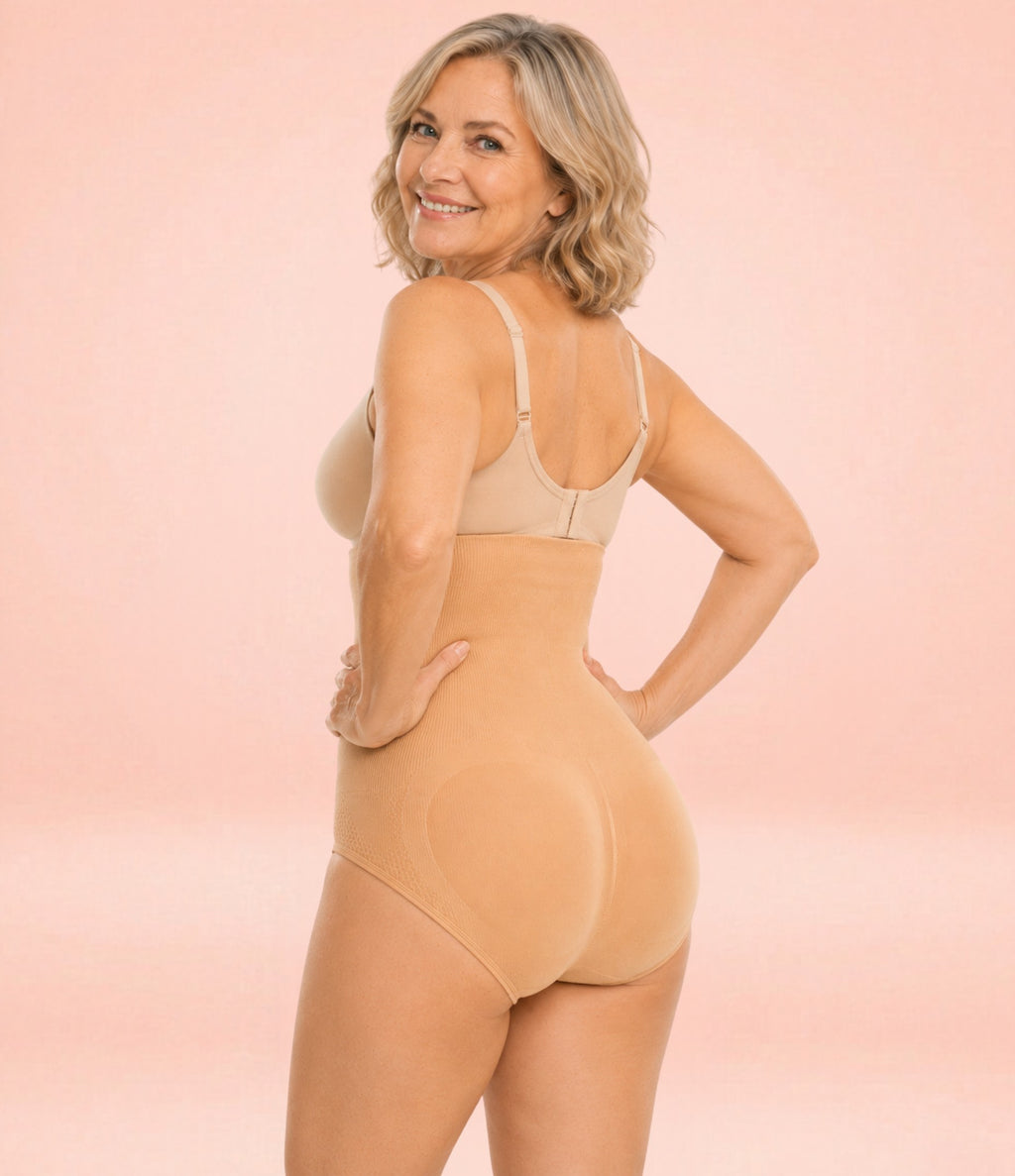 Back view of mature woman wearing beige high-waist shaping brief with seamless tummy control and sculpting support