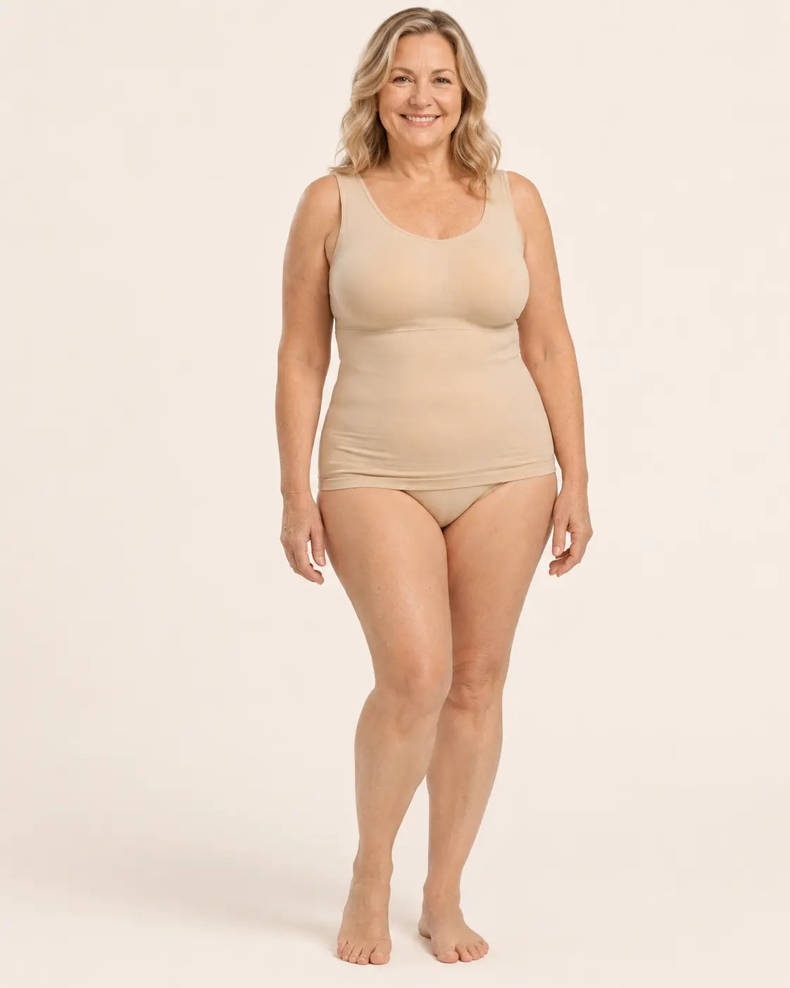 Plus-size woman in her 50s wearing the OnlyShape seamless shaping 
tank top in beige nude, full-body view showing wire-free comfort 
and natural fit for sizes S to 3XL Image